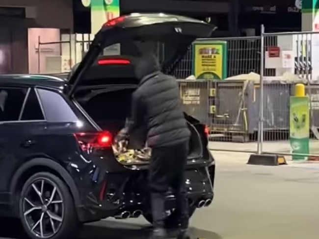 A youth loads cigarettes into a Volkswagen. Picture: Supplied