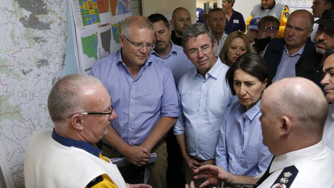 Mr Morrison and NSW Premier Gladys Berejiklian are briefed on the fires at Mid North Coast Fire Control Centre in Wauchope on Sunday.