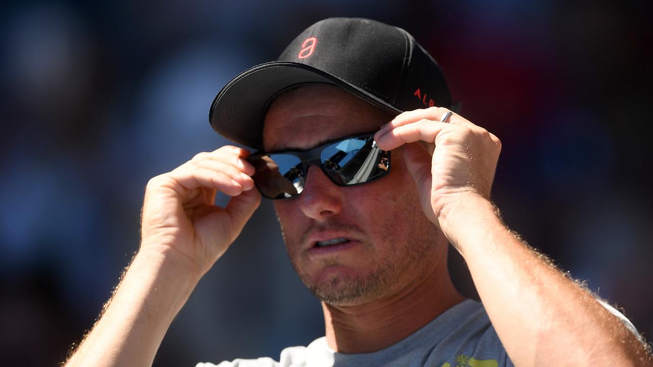 Lleyton Hewitt watches Alex de Minaur at the Austraiian Open.