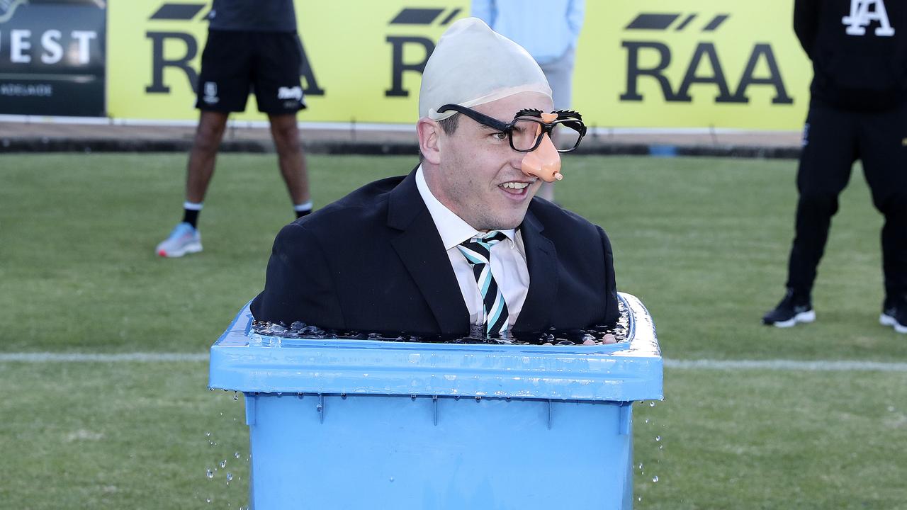 Tom Rockliff takes an ice bath as Port Adelaide chairman David Koch. Photo: Sarah Reed