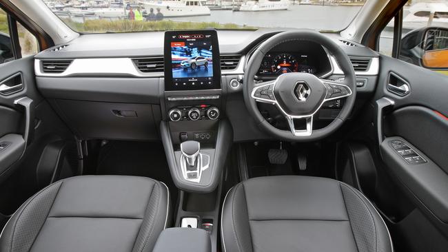 The interior is dominated by a huge tablet-style screen.