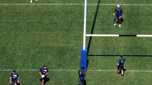 Cronk (top in white hat) watches his teammates train. (Sam Ruttyn)