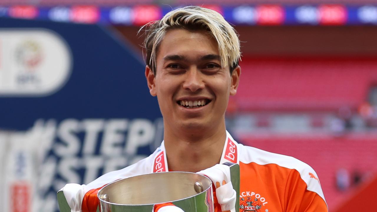 LONDON, ENGLAND - MAY 30: Kenny Dougall of Blackpool celebrates with the Sky Bet League One Play-off Trophy following victory in the Sky Bet League One Play-off Final match between Blackpool and Lincoln City at Wembley Stadium on May 30, 2021 in London, England. (Photo by Catherine Ivill/Getty Images)