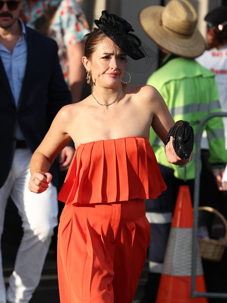 Punters leave Eagle Farm racecourse on Melbourne Cup Day.