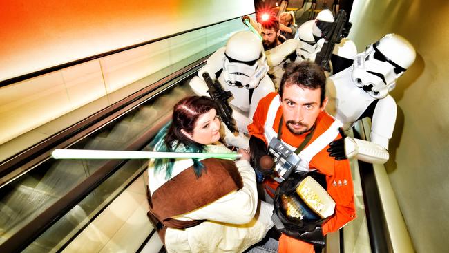 The escalators at IMAX Melbourne were filled with X-wing pilots, jedi knights and stormtroopers at midnight screenings early Thursday morning. Picture: Tony Gough