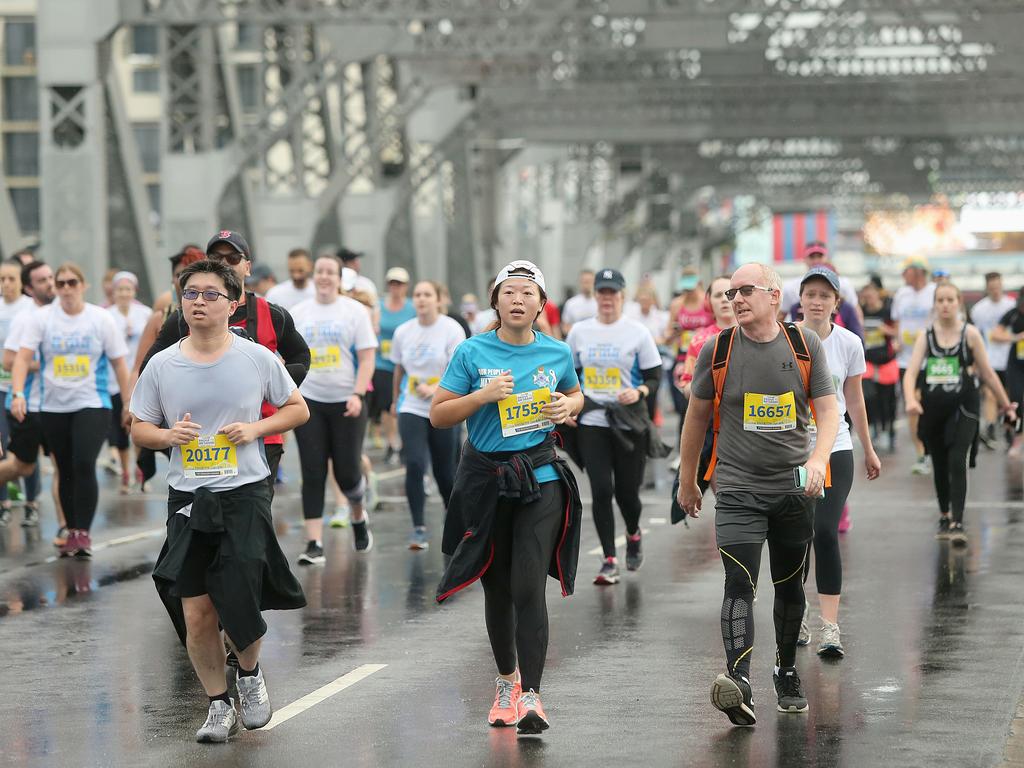 <p>Runners on the Story Bridge at the Sunday Mail Bridge to Brisbane fun Run, Sunday August 26, 2018. (AAP Image/Jono Searle)</p>