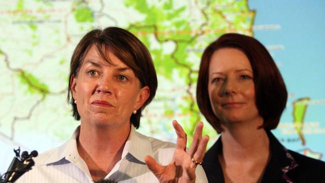 Then-premier Anna Bligh and Julia Gillard at a media conference in Kedron during the Brisbane floods, on January 12, 2011. Picture: Bradley Kanaris/Getty Images