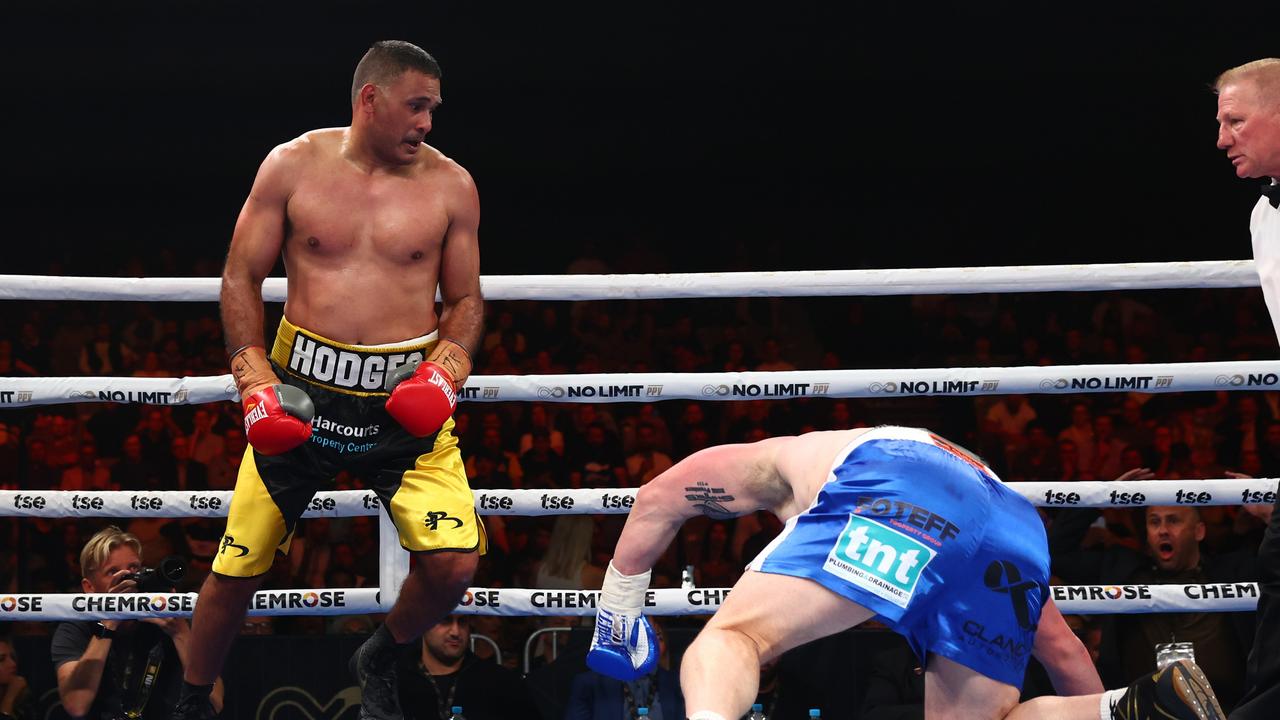 BRISBANE, AUSTRALIA - SEPTEMBER 15: Justin Hodges knocks down Paul Gallen during their bout at Nissan Arena on September 15, 2022 in Brisbane, Australia. (Photo by Chris Hyde/Getty Images)