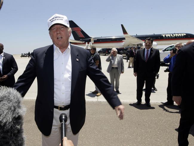 Republican presidential hopeful Donald Trump speaks after arriving at the airport for a visit to the U.S. Mexico border in Laredo, Texas, Thursday, July 23, 2015. (AP Photo/LM Otero)