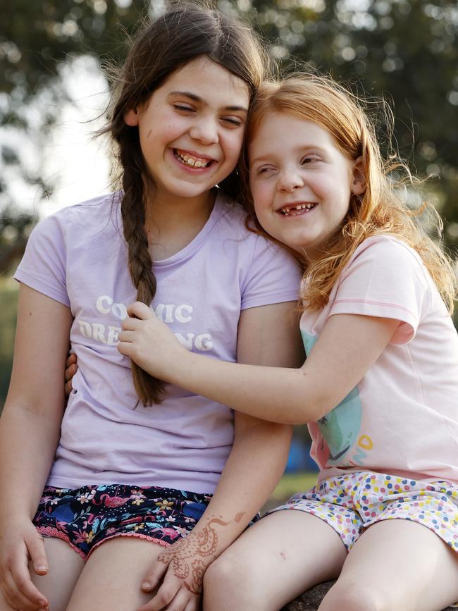 The NSW Government will announce a new buddy system for kids during school holidays, pleasing Millie Jelley, 9, (left) with her sister Celia, 6. Picture: Jonathan Ng
