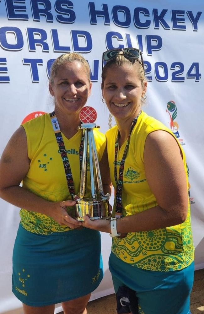 Sisters Kim Reibel and Toni Chirio with the cherished Masters World Cup trophy.