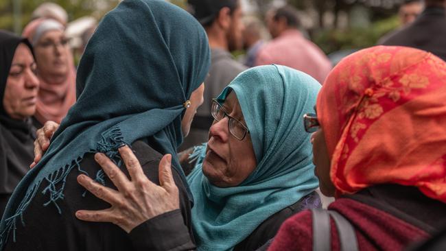 Muslim women comfort each other after visiting Al Noor Mosque on March 18, 2019 in Christchurch, New Zealand today. Picture: Carl Court/Getty