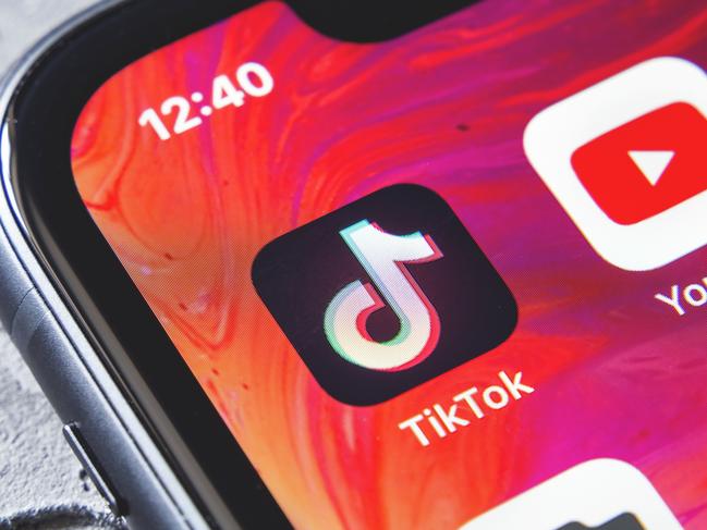 TikTok and YouTube apps on screen iphone xr, close up