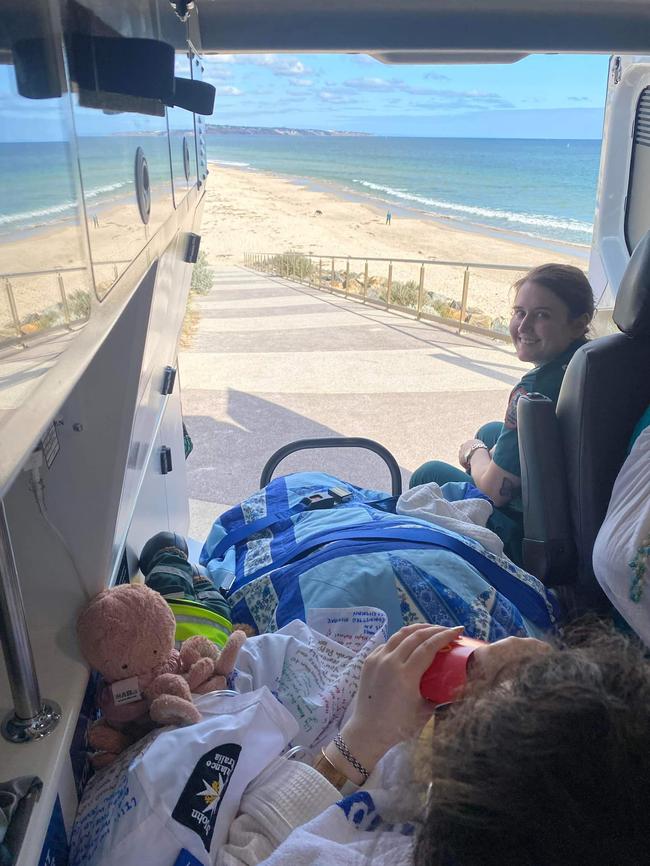 Lily Thai and Danika Pederzolli in the back of an ambulance, enjoying McDonald's at the beach. Picture: Danika Pederzolli / Facebook