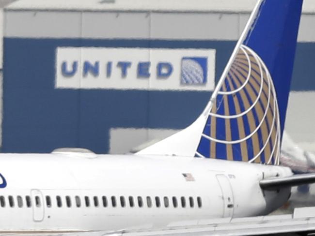 FILE - In this Sept. 9, 2015 file photo, a United Airlines passenger plane lands at Newark Liberty International Airport in Newark, N.J. United Continental is naming two new directors to its board, Wednesday, April 20, 2016, putting behind it, at least for now, a contentious fight with two big shareholders. (AP Photo/Mel Evans, file)