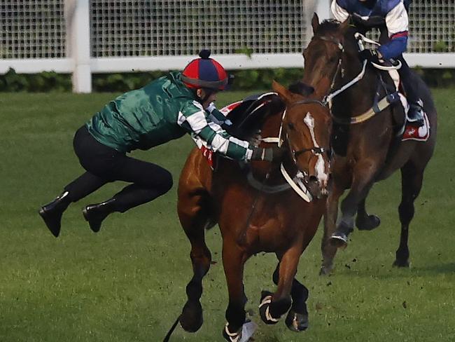 NCA. MELBOURNE, AUSTRALIA. October 21, 2024. RACING.  Mooney Valley Breakfast with the Best track gallops.  Jockey James McDonald is unseated while riding the Chris Waller trained Via Sistina  during a track work session at Moonee Valley this morning .  Pic : Michael Klein