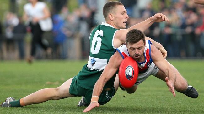 Luke Lirosi battles Michael Croxford for the ball. Picture: Hamish Blair