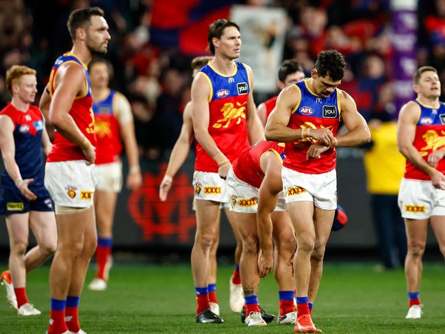 MELBOURNE, AUSTRALIA - JULY 14: Lions players look dejected after a loss during the 2023 AFL Round 18 match between the Melbourne Demons and the Brisbane Lions at the Melbourne Cricket Ground on July 14, 2023 in Melbourne, Australia. (Photo by Dylan Burns/AFL Photos via Getty Images)