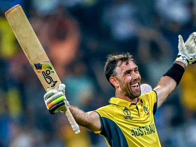 Australia's Glenn Maxwell celebrates after winning the 2023 ICC Men's Cricket World Cup one-day international (ODI) match between Australia and Afghanistan at the Wankhede Stadium in Mumbai on November 7, 2023. (Photo by INDRANIL MUKHERJEE / AFP) / -- IMAGE RESTRICTED TO EDITORIAL USE - STRICTLY NO COMMERCIAL USE --