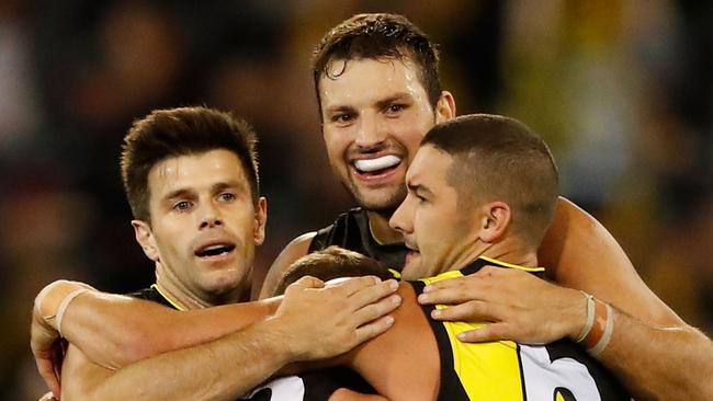 Trent Cotchin, Kane Lambert, Toby Nankervis and Shaun Grigg. (Photo by Adam Trafford/AFL Media/Getty Images)