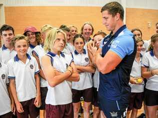 McAuley Catholic College year nine student Logan Trivett squares up with Gold Coast Titans front rower Jarrod Wallace at a recent NRL Community Carnival event at the school. Picture: Matthew Elkerton