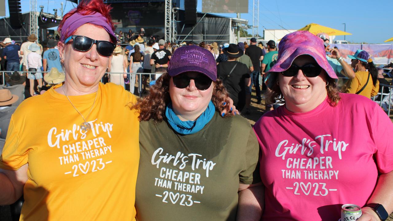 Janelle (right) flew up from Melbourne to join friends Diane (left) and Tiffany (middle) on a girls' trip their T-shirts proclaimed was "cheaper than therapy".