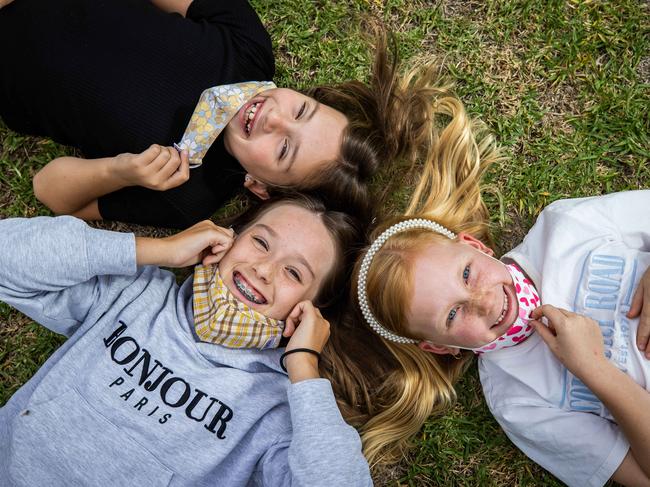 Sisters Olivia, 9, and Ellie, 12, and cousins Milla, 7, have been masked at school. Picture: Tom Huntley