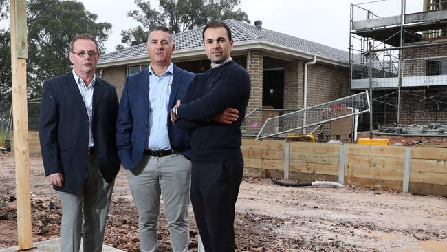 Pictured in Leppington in western Sydney are Romeo Tamburri, Emilio Raco and Antonio Gerace. They are unhappy with the way land release and the building homes is being handled in western Sydney. Picture: Richard Dobson