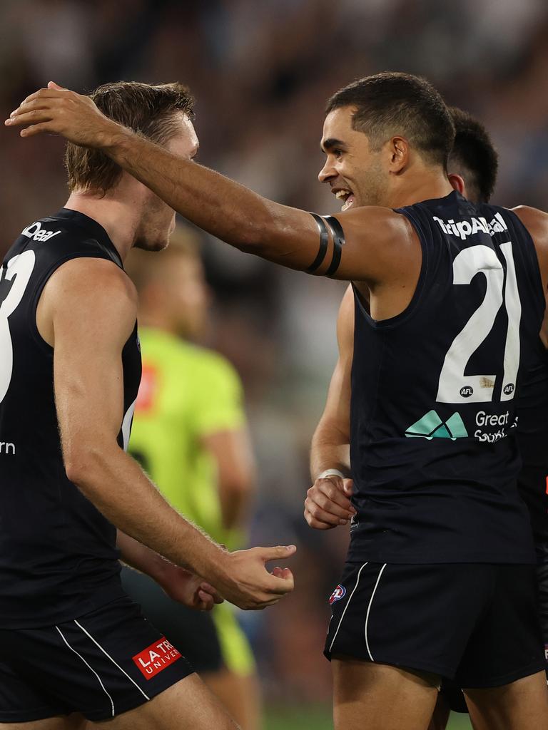 Jack Martin embraces teammates during Carlton’s win over Richmond.