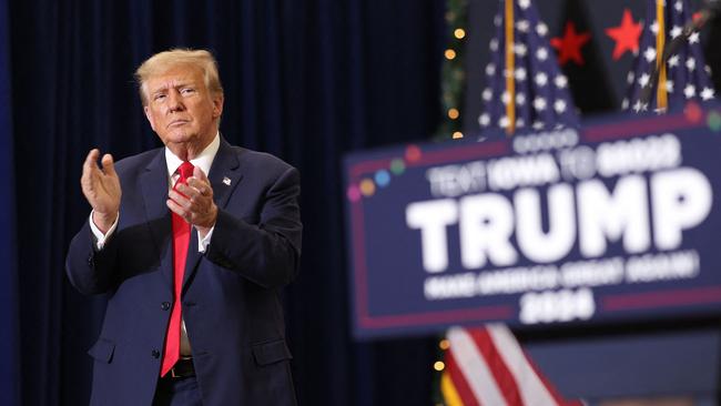 WATERLOO, IOWA - DECEMBER 19: Republican presidential candidate and former U.S. President Donald Trump claps as he wraps up a campaign event on December 19, 2023 in Waterloo, Iowa. Iowa Republicans will be the first to select their party's nomination for the 2024 presidential race, when they go to caucus on January 15, 2024. Scott Olson/Getty Images/AFP (Photo by SCOTT OLSON / GETTY IMAGES NORTH AMERICA / Getty Images via AFP)