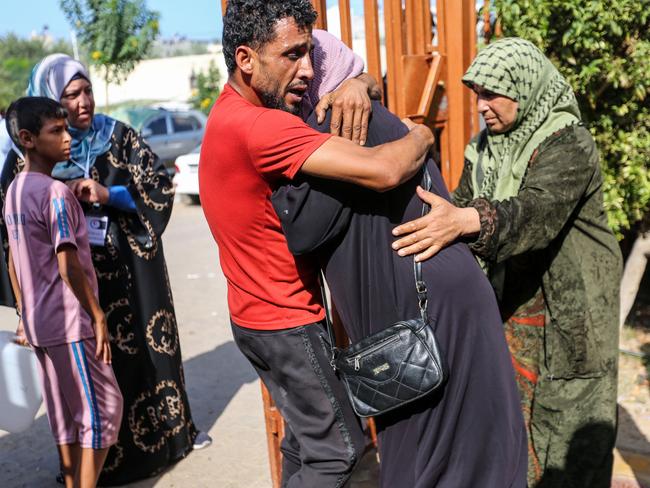 People mourn as they collect the bodies of Palestinians killed in Israeli air raids in Khan Yunis, Gaza. Picture: Getty Images