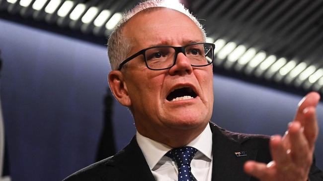 Australia's former prime minister Scott Morrison speaks to media during a press conference in Sydney on August 17, 2022. - Australia's Prime Minister Anthony Albanese on August 16 said that his predecessor Scott Morrison secretly seized control of five ministerial posts, labelling it an "unprecedented trashing of our democracy". (Photo by Steven Saphore / AFP)