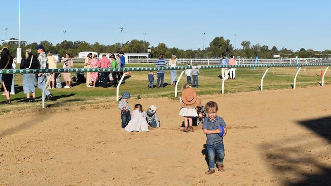 Spectators cheer on as they watch the B Grade St George vs Condamine match at the Roma Rugby Races at Bassett Park. Picture: Chloe Cufflin.
