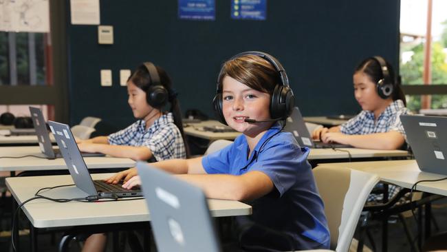 Years 3,5,7 and 9 students have begun the annual NAPLAN tests, which some Cairns schools are sitting completely online. Peace Lutheran College Grade 5 students Lilly Jeon. 9, Myles Dever, 10, and Arin Hang, 10, go hi-tech for this year's test. Picture: Brendan Radke