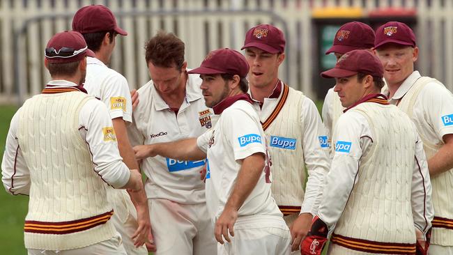 Matthew Gale celebrates a wicket with his Queensland teammates in 2012.