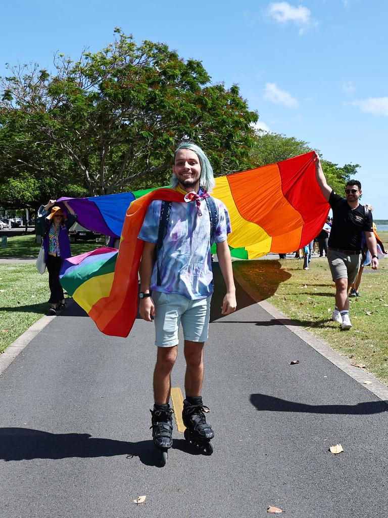 A small group of LGBTIQ people and supporters paraded along the Cairns Esplanade with a huge rainbow flag for the Pride Stride, part of the Cairns Pride Festival. Liam Johnston led part way of the march on his rollerblades. Picture: Brendan Radke