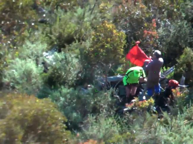 Dramatic video has captured the moment two hikers were rescued from a remote alpine mountain. Picture: Victoria Police