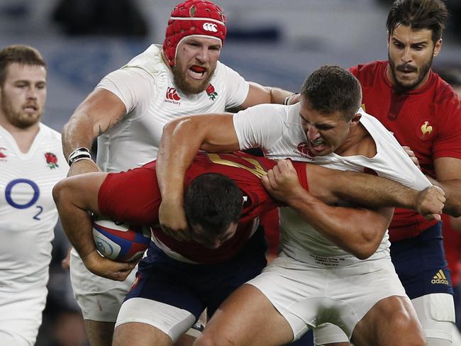 England centre Sam Burgess (R) tackles France's N°8 Louis Picamoles during a Rugby World Cup warm up match between England and France at Twickenham Stadium, west of London on August 15, 2015. AFP PHOTO / ADRIAN DENNIS