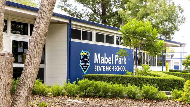 Student were seen waiting outside Mabel Park State High School after being informed about the school’s coronavirus policy. Picture: AAP Image/Richard Walker