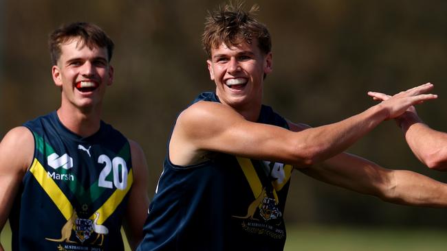MELBOURNE, AUSTRALIA - APRIL 13: Cooper Duff-Tytler of the AFL National Academy is congratulated by team mates after kicking a goal during the Marsh AFL National Academy Boys match between Australia U18 and Richmond VFL at RSEA Park on April 13, 2025 in Melbourne, Australia. (Photo by Josh Chadwick/AFL Photos/via Getty Images)