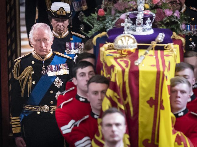 LONDON, ENGLAND - SEPTEMBER 19: King Charles III follows behind the coffin of Queen Elizabeth II, draped in the Royal Standard with the Imperial State Crown and the Sovereign's orb and sceptre, as it is carried out of Westminster Abbey. after the State Funeral of Queen Elizabeth II on September 19, 2022 in London, England. Elizabeth Alexandra Mary Windsor was born in Bruton Street, Mayfair, London on 21 April 1926. She married Prince Philip in 1947 and ascended the throne of the United Kingdom and Commonwealth on 6 February 1952 after the death of her Father, King George VI. Queen Elizabeth II died at Balmoral Castle in Scotland on September 8, 2022, and is succeeded by her eldest son, King Charles III. (Photo by Danny Lawson - WPA Pool/Getty Images)