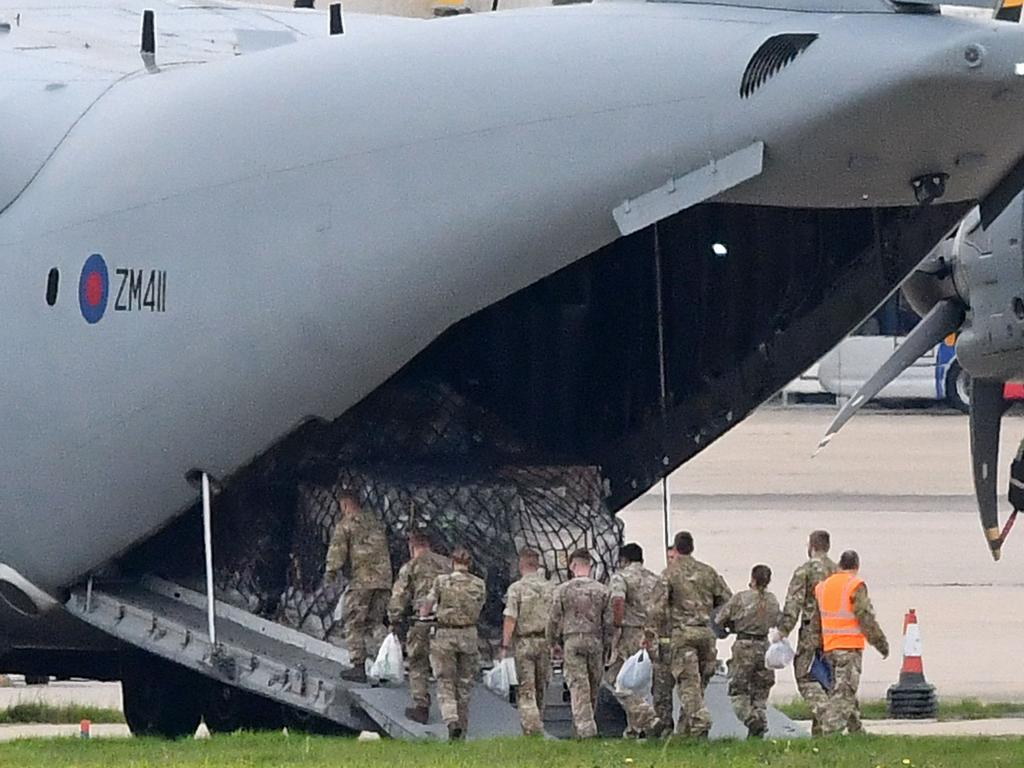 Military personnel board a Royal Air Force (RAF) Airbus A400M transport plane at RAF Brize Norton, southern England, on August 17. Picture: AFP