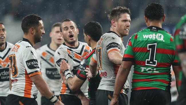 Wests Tigers playmaker Josh Reynolds and Souths’ Latrell Mitchell, No 1 exchange words at Bankwest Stadium. Picture: Brett Costello