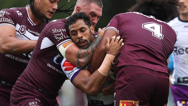 Melbourne's Josh Addo-Carr is tackled during the Manly Sea Eagles v Melbourne Storm NRL match at Lottoland, Brookvale. Picture: Brett Costello