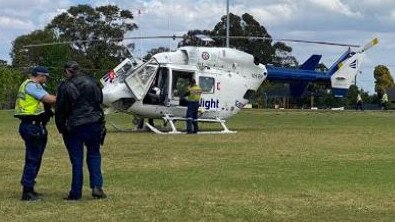 A CareFlight emergency response helicopter landed on Killarney Heights Oval so its doctor could help treat a tiler who had a severely lacerate arm at a nearby building site. Picture: CareFlight