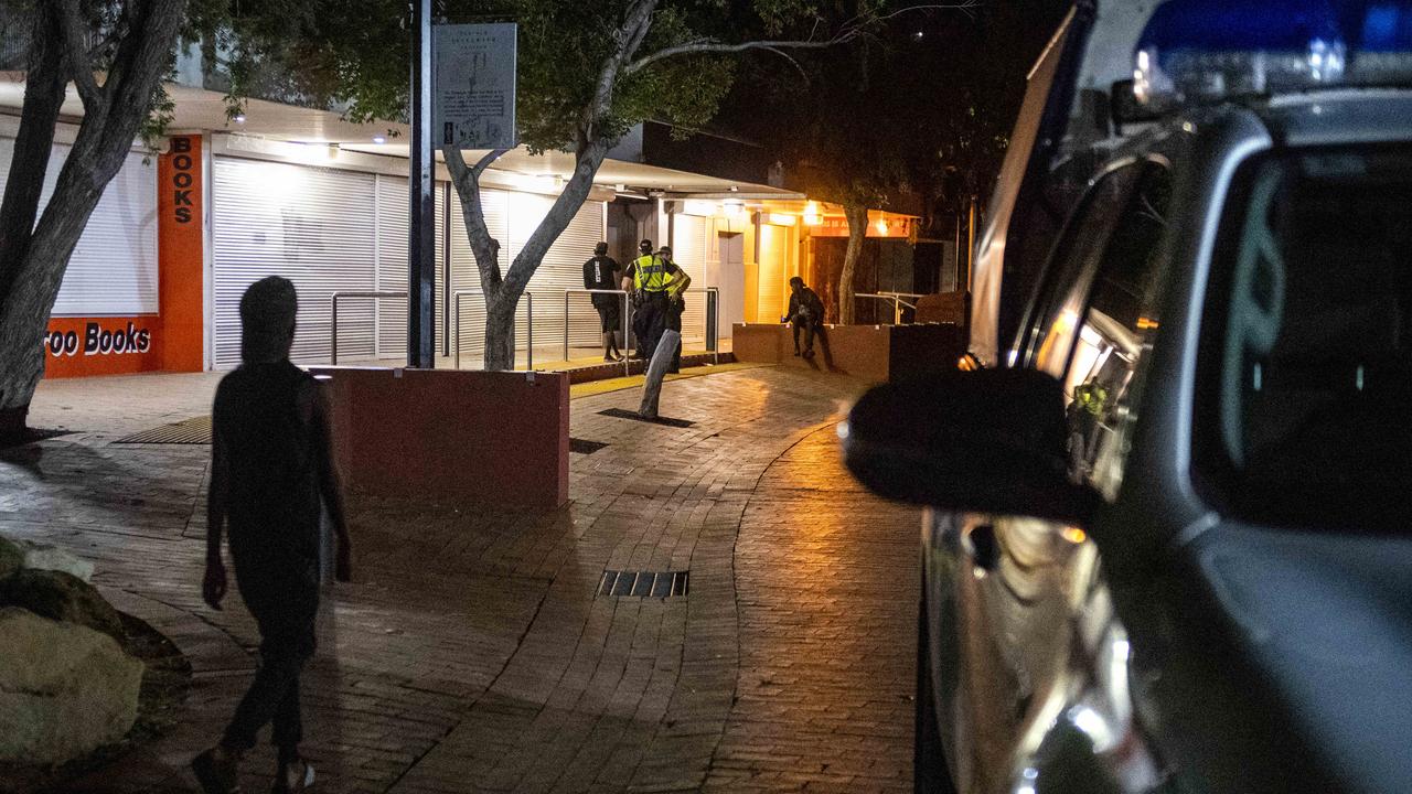 Police officers chat to a young man on the streets of Alice Springs at night. Thursday January 26,2023. Picture Mark Brake