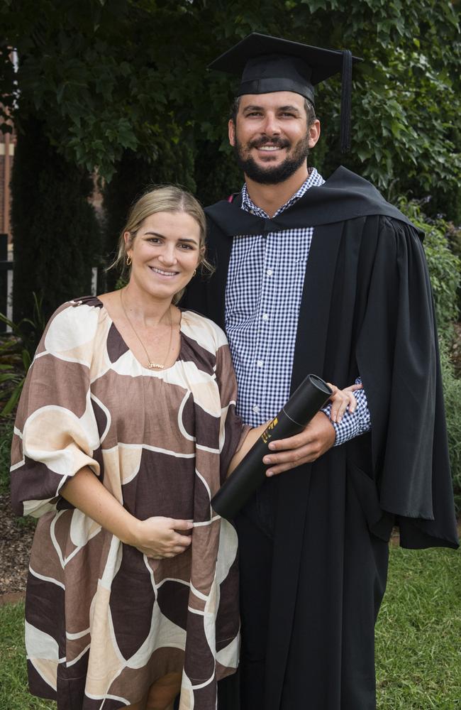 Bachelor of Surveying (Honours) graduate Jake Linnett is congratulated by partner Lena Hewitt at a UniSQ graduation ceremony at Empire Theatres, Wednesday, February 14, 2024. Picture: Kevin Farmer