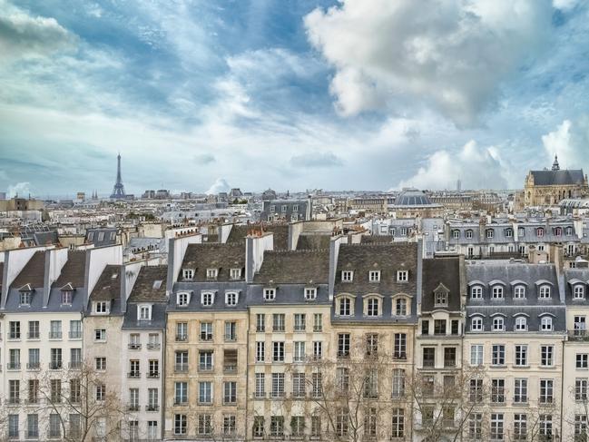 Paris, typical buildings in the Marais, aerial view with the Saint-Eustache church, the Eiffel Tower and the Defense in background