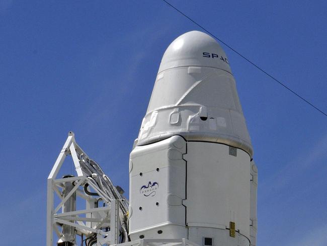 SpaceX's Falcon 9 rocket with the Dragon space craft are readied on October 7, 2012 for an evening launch from Cape Canaveral, Florida, to the International Space Station. This is the first of 12 flights in its 1.6 billion USD contract with NASA to bring supplies to and from the international space station. AFP PHOTO/Bruce Weaver