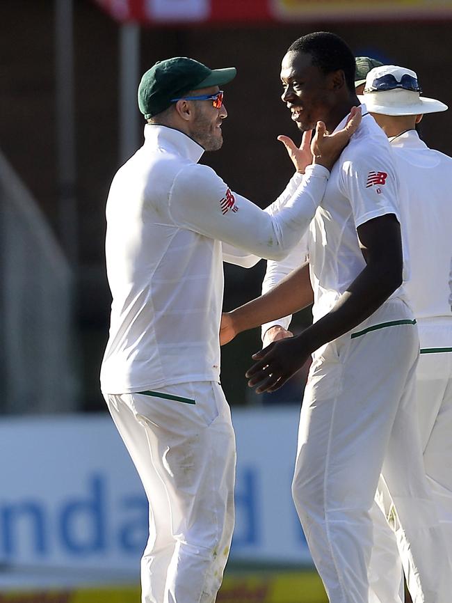 Faf du Plessis (capt) of South Africa celebrate with Kagiso Rabada after taking the wicket of Usman Khawaja.